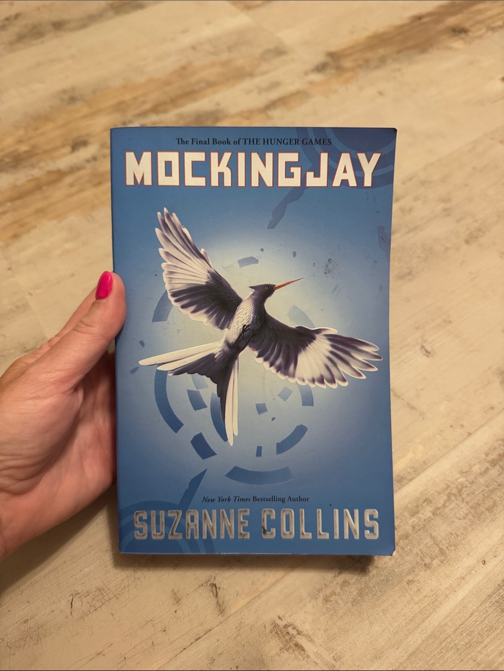Mockingjay by Suzanne Collins — Blue Cover Novel